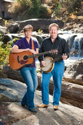 Jim and Valerie Gabehart with a guitar and banjo