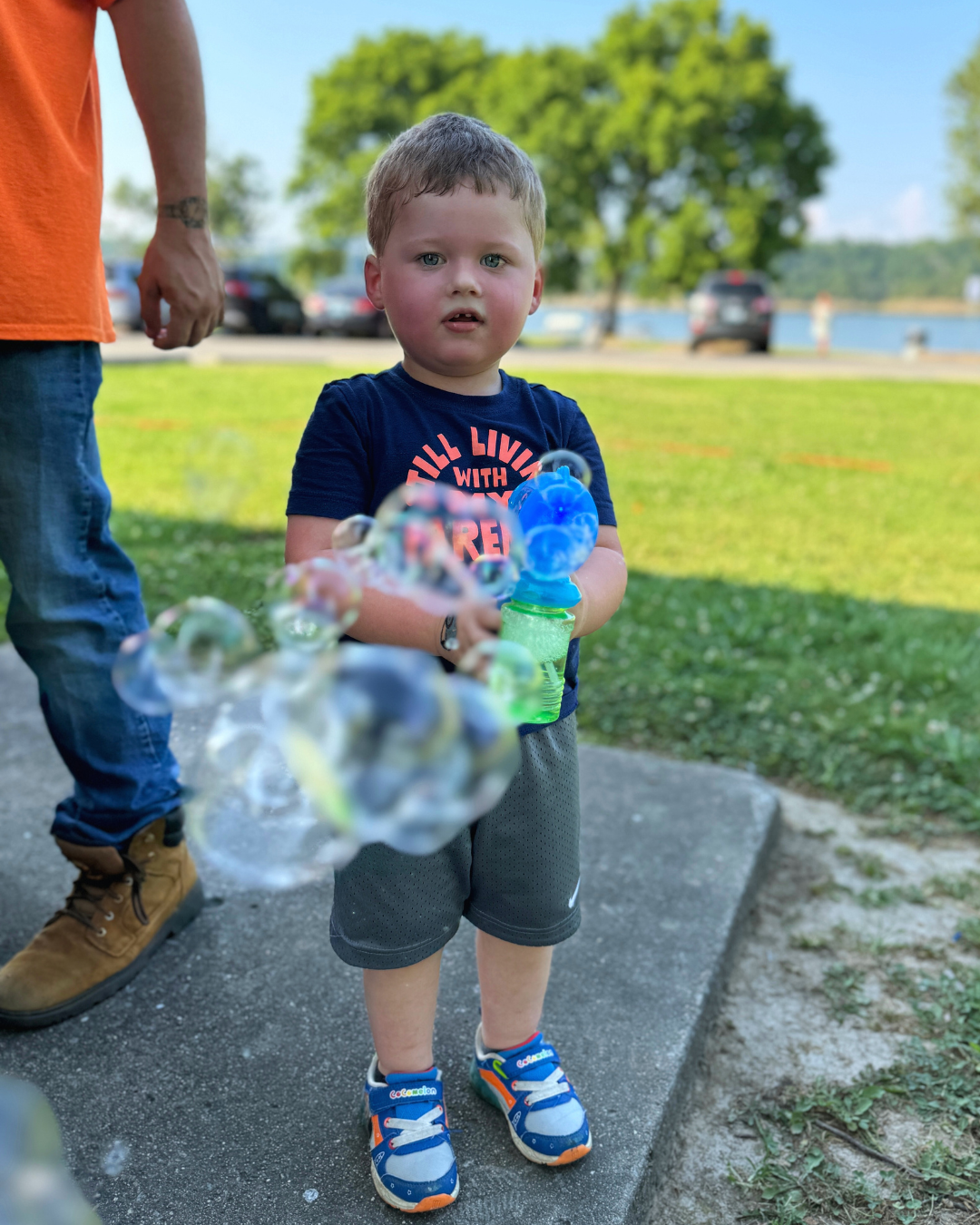boy blowing bubbles
