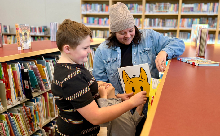 a family browsing books at tcpl